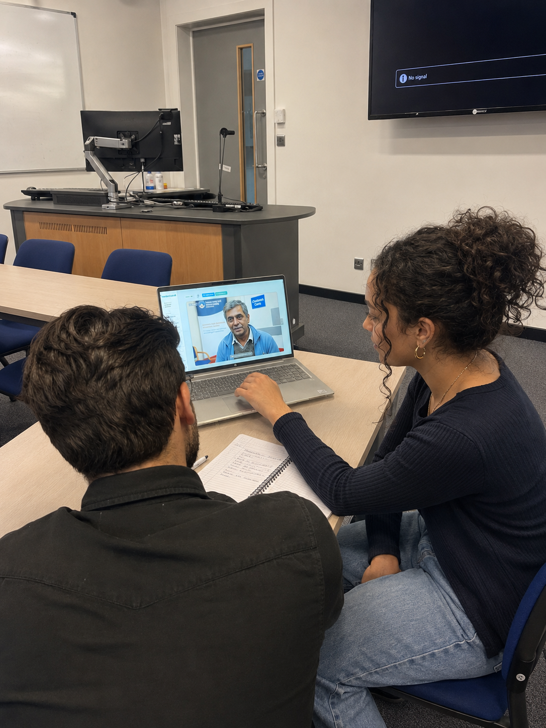 Lecturer leading a blended teaching session with students