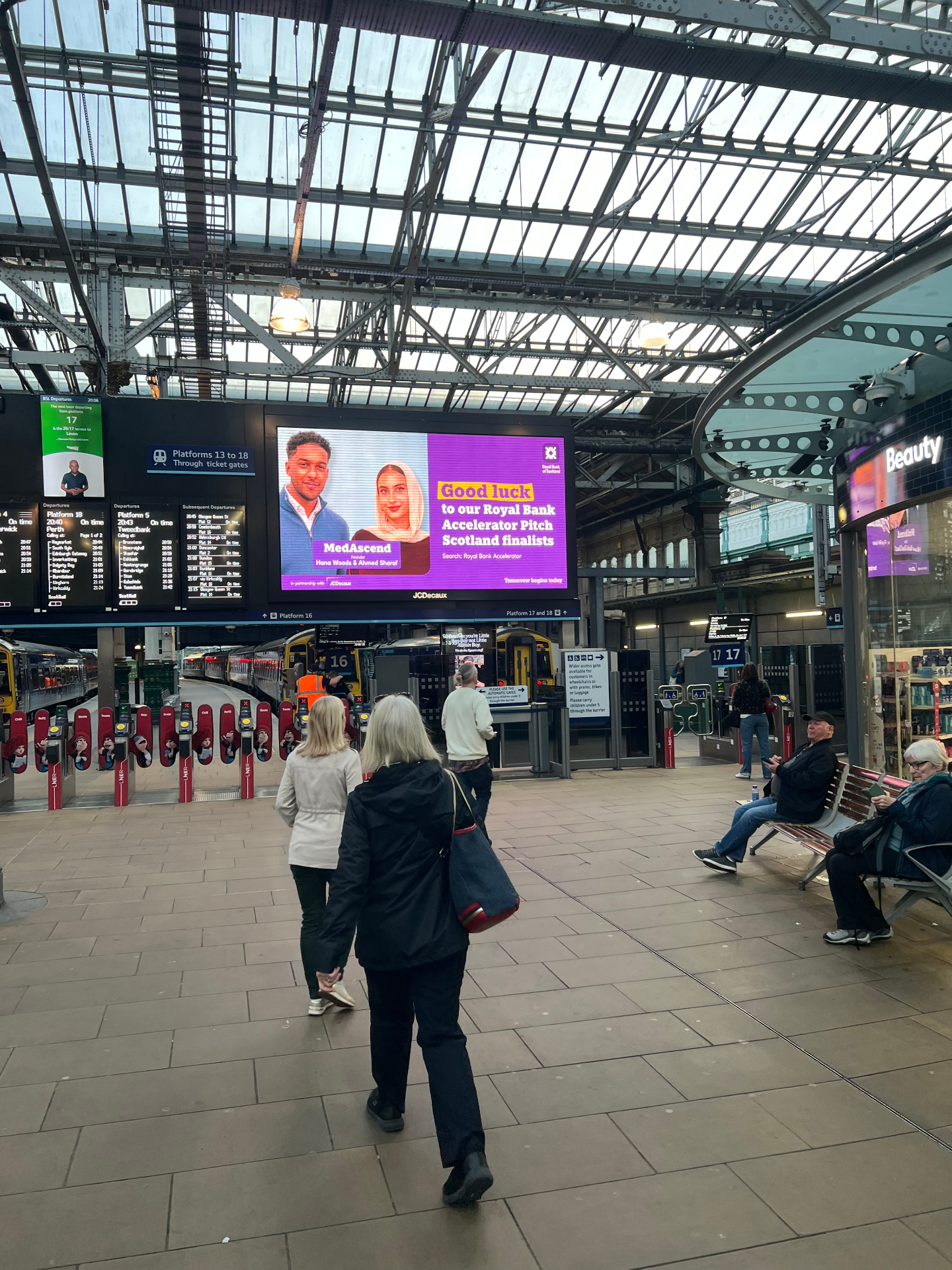 MedAscend founders featured on a JCDecaux billboard at Edinburgh Waverley station as Royal Bank Accelerator Pitch Scotland finalists